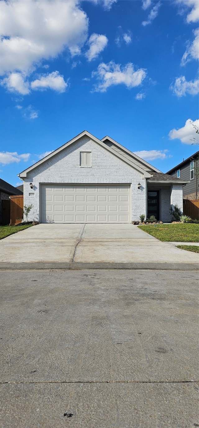 ranch-style house featuring a garage