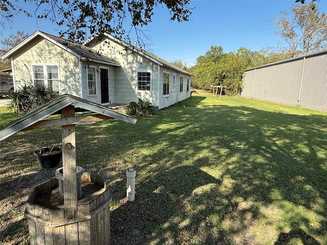 view of side of home featuring a lawn