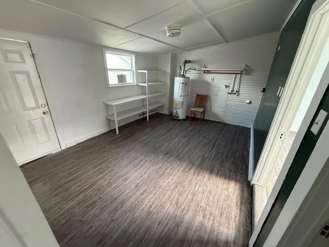 4822 W Cedar Bayou Lynchburg Rd, Baytown, TX 77521 - interior space with gas water heater, wood finished floors, and baseboards