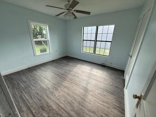 4822 W Cedar Bayou Lynchburg Rd, Baytown, TX 77521 - unfurnished bedroom with dark wood-style floors, baseboards, and a ceiling fan