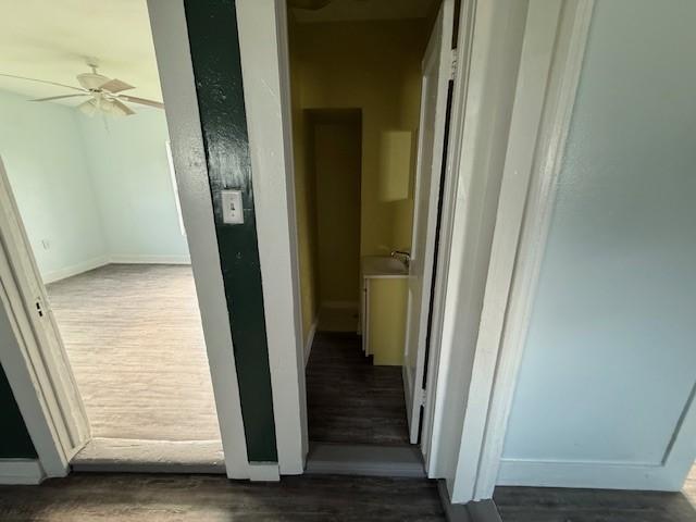 4822 W Cedar Bayou Lynchburg Rd, Baytown, TX 77521 - corridor featuring wood finished floors and baseboards