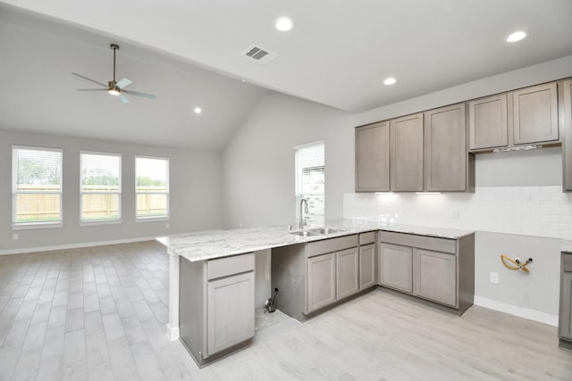 14906 Rural Ridge Rd, Cypress, TX 77429 - kitchen with a peninsula, backsplash, open floor plan, lofted ceiling, and recessed lighting