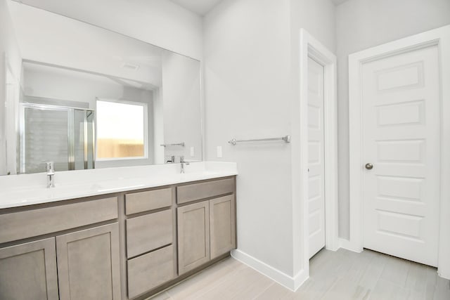 14906 Rural Ridge Rd, Cypress, TX 77429 - bathroom with a shower stall and double vanity