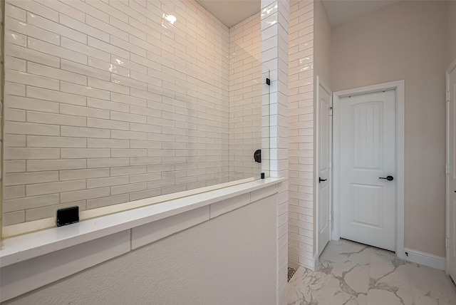 bathroom with tiled shower