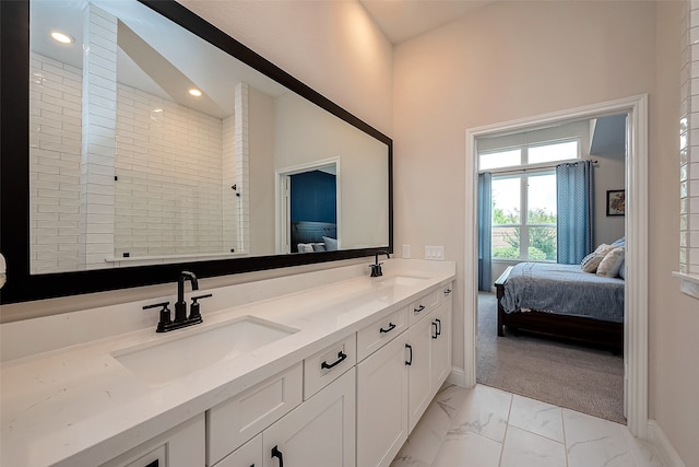 bathroom with vanity and tiled shower