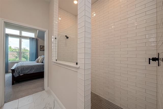 bathroom with tiled shower