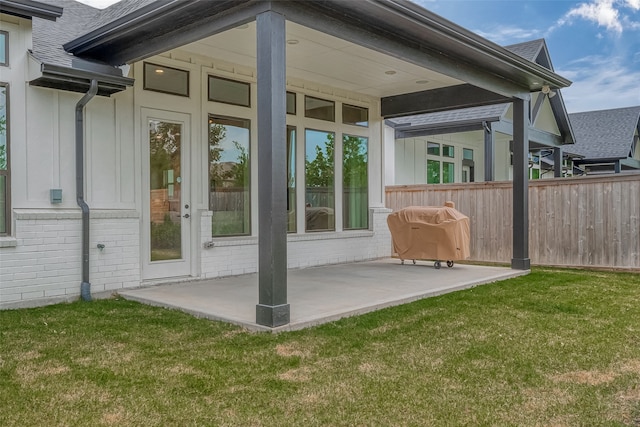 exterior space featuring a yard and a patio area