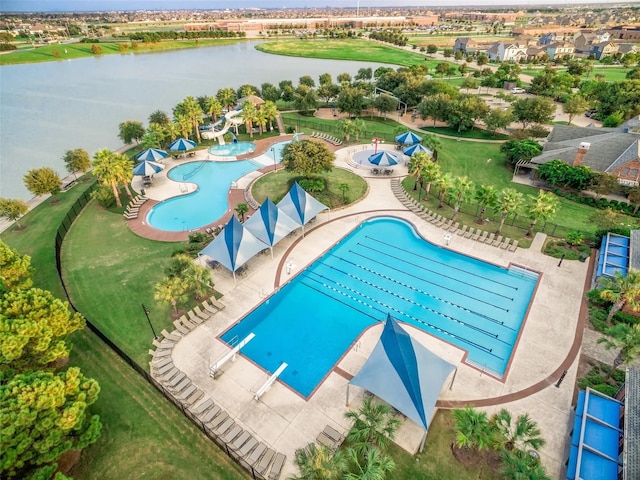 view of swimming pool with a water view