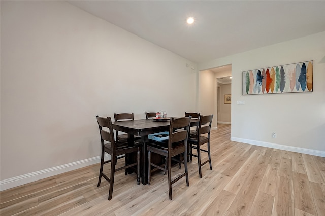 dining space with light hardwood / wood-style floors