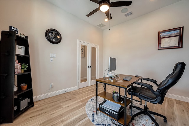 home office featuring french doors, light hardwood / wood-style flooring, and ceiling fan