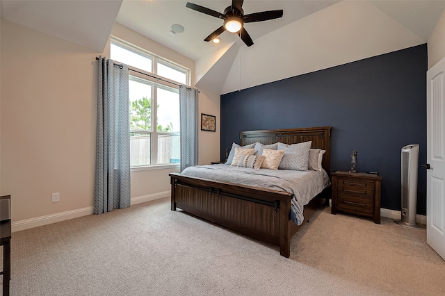 bedroom featuring ceiling fan, high vaulted ceiling, and light carpet