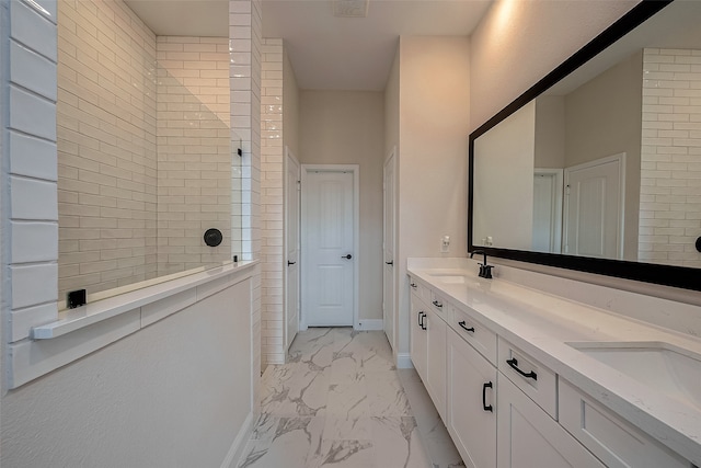 bathroom featuring vanity and tiled shower