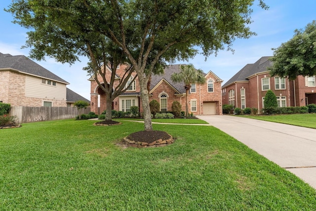 view of front of house featuring a front yard and a garage