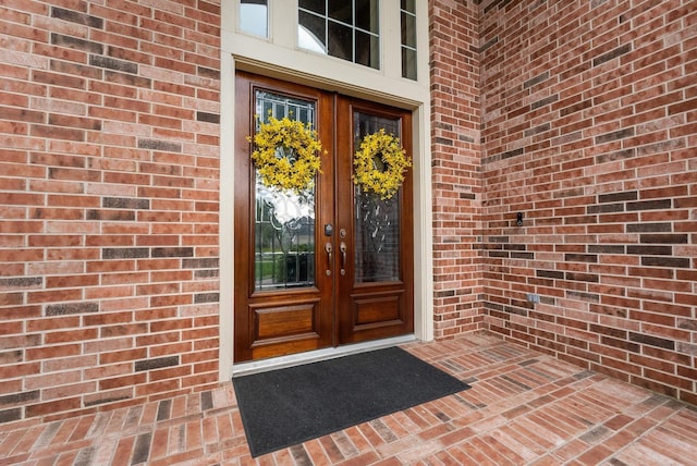 view of exterior entry featuring french doors