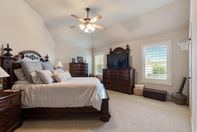 bedroom featuring ceiling fan, light carpet, and vaulted ceiling