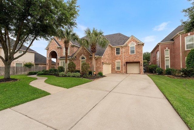 view of front property featuring a front yard and a garage