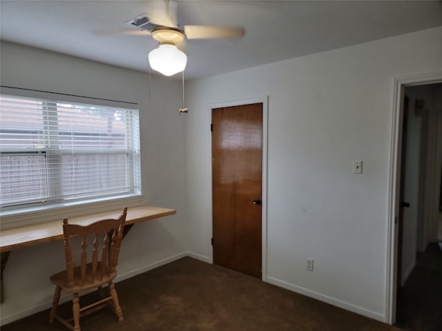 carpeted office with ceiling fan