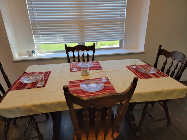 dining space featuring hardwood / wood-style floors and a healthy amount of sunlight