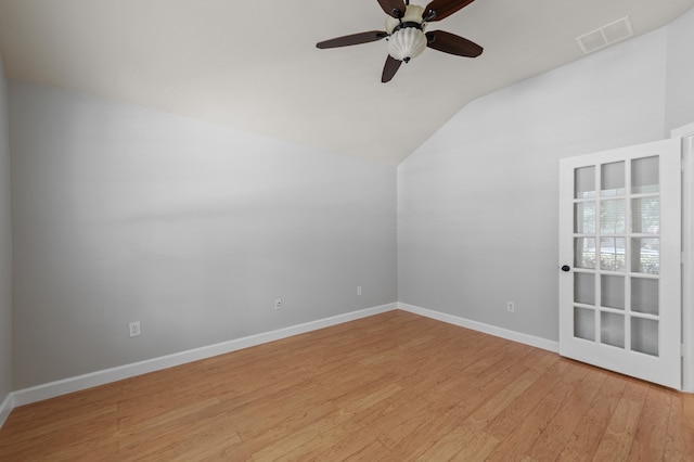 additional living space featuring lofted ceiling, ceiling fan, and light wood-type flooring