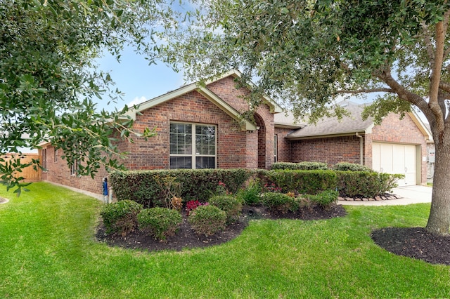 ranch-style home with a garage and a front yard