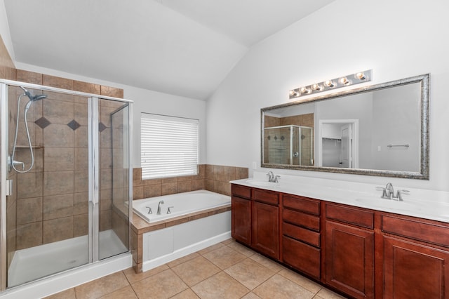 bathroom featuring shower with separate bathtub, vanity, tile patterned floors, and lofted ceiling