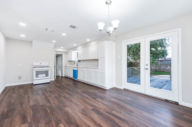 kitchen with dark hardwood / wood-style floors, white cabinetry, white stove, and french doors