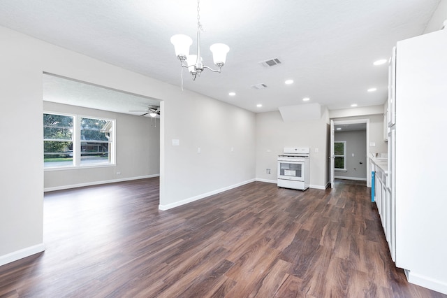 unfurnished living room with a textured ceiling, ceiling fan with notable chandelier, and dark hardwood / wood-style floors