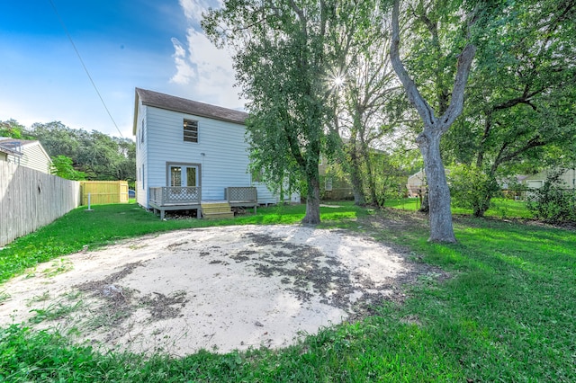 rear view of house with a yard