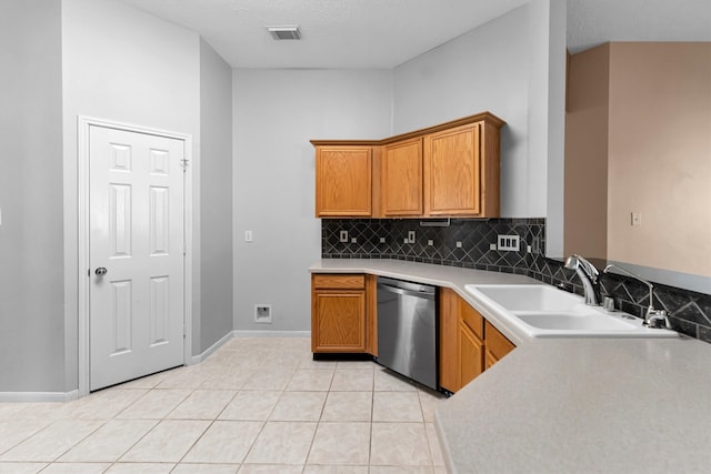 kitchen featuring stainless steel dishwasher, backsplash, light tile patterned flooring, and sink