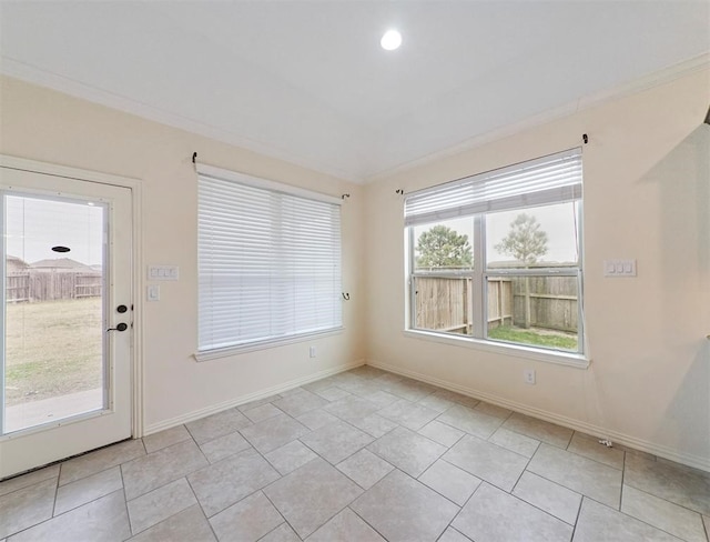 tiled spare room with ornamental molding