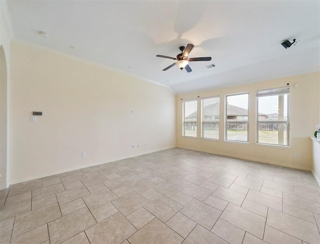 unfurnished room with crown molding, ceiling fan, and light tile patterned floors