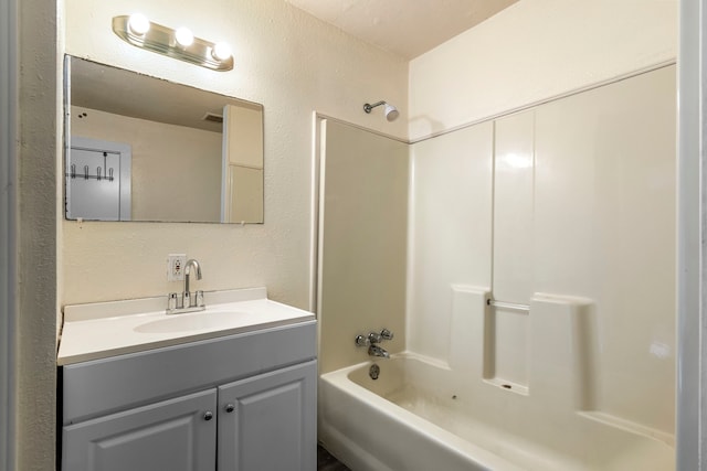 bathroom with vanity and tub / shower combination