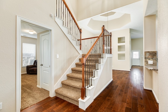 stairway with hardwood / wood-style flooring