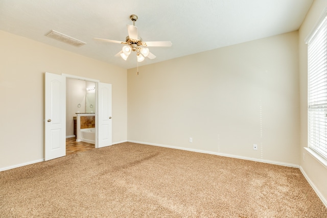 unfurnished bedroom with carpet flooring and ceiling fan