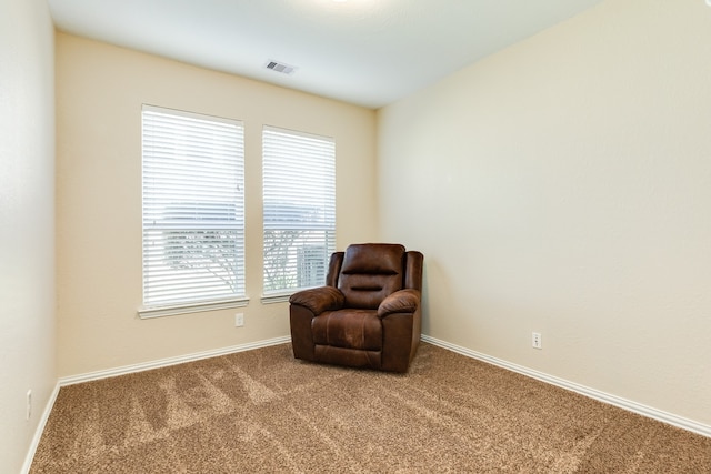 living area featuring carpet floors