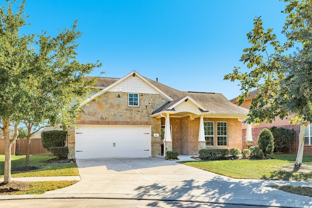 view of front of property with a garage and a front yard