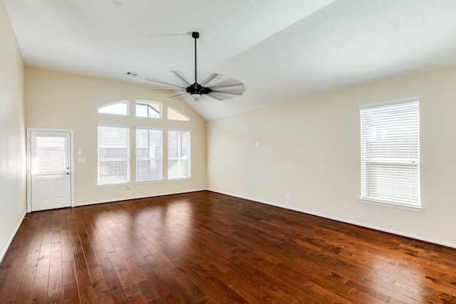 unfurnished living room featuring dark hardwood / wood-style floors, ceiling fan, and vaulted ceiling