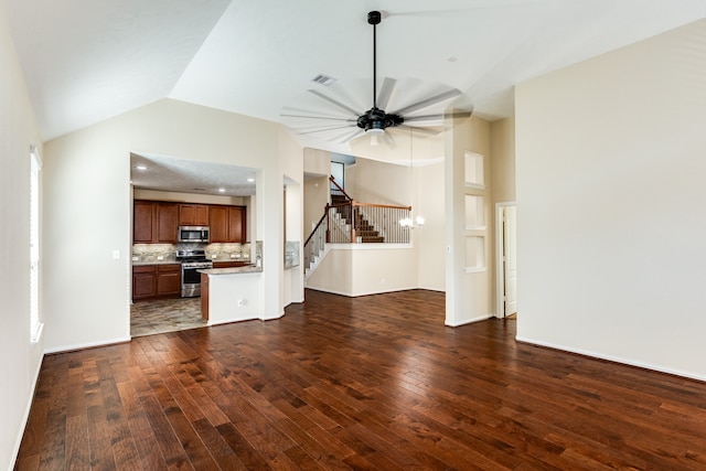 unfurnished living room with lofted ceiling, dark hardwood / wood-style flooring, and ceiling fan with notable chandelier