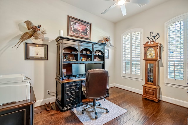 home office with ceiling fan and dark hardwood / wood-style flooring