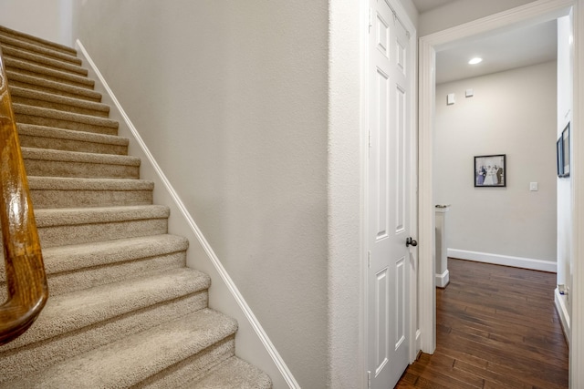 staircase featuring wood-type flooring