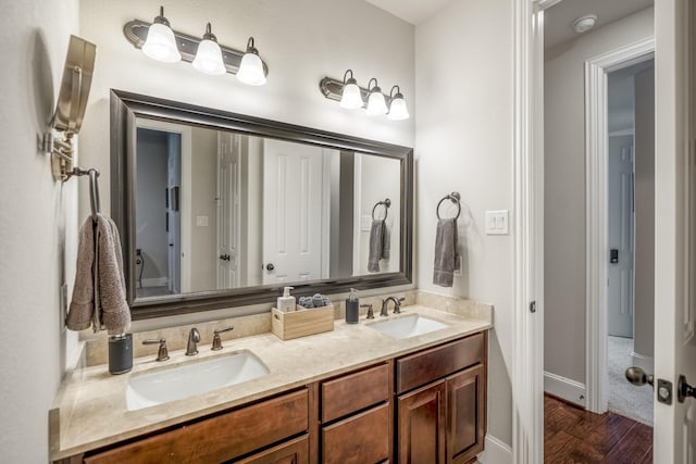 bathroom featuring hardwood / wood-style floors and vanity