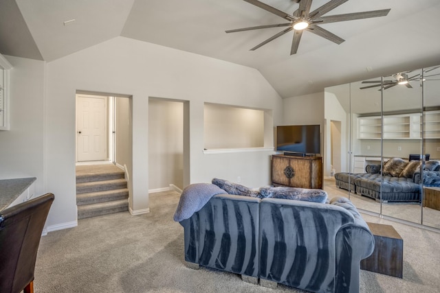 living room featuring light carpet, vaulted ceiling, and ceiling fan