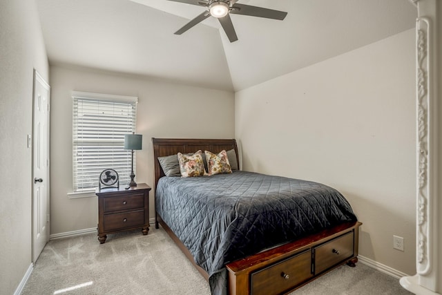 carpeted bedroom featuring ceiling fan and lofted ceiling