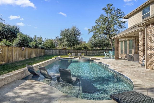 view of swimming pool with a patio area and an in ground hot tub