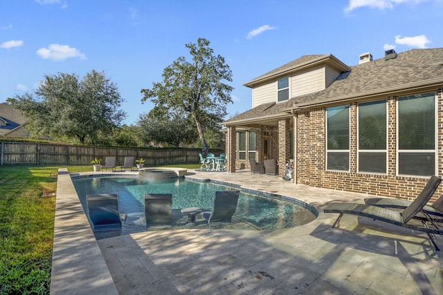 view of swimming pool with an in ground hot tub and a patio