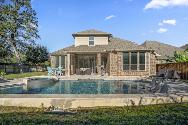 view of pool featuring an in ground hot tub and a patio