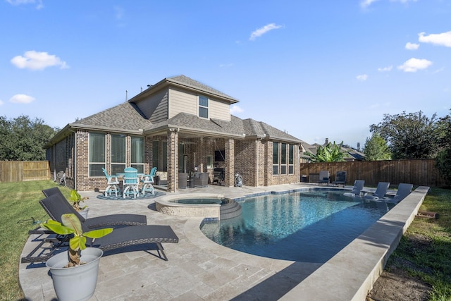 view of pool featuring an in ground hot tub and a patio