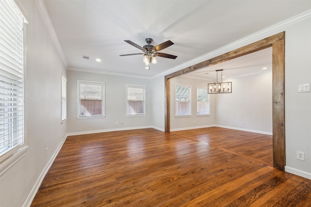 unfurnished room with plenty of natural light, dark hardwood / wood-style flooring, and crown molding