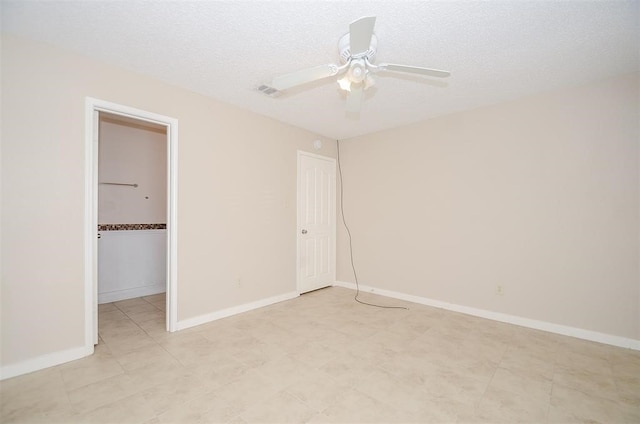 unfurnished bedroom featuring ceiling fan and a textured ceiling