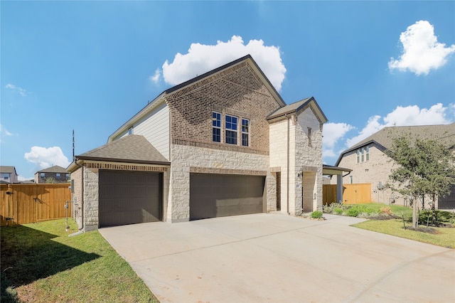 view of front of property with a garage and a front lawn